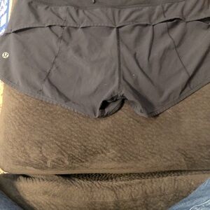 Back Lululemon shorts waist measures 15 inches. Length 9 inches long